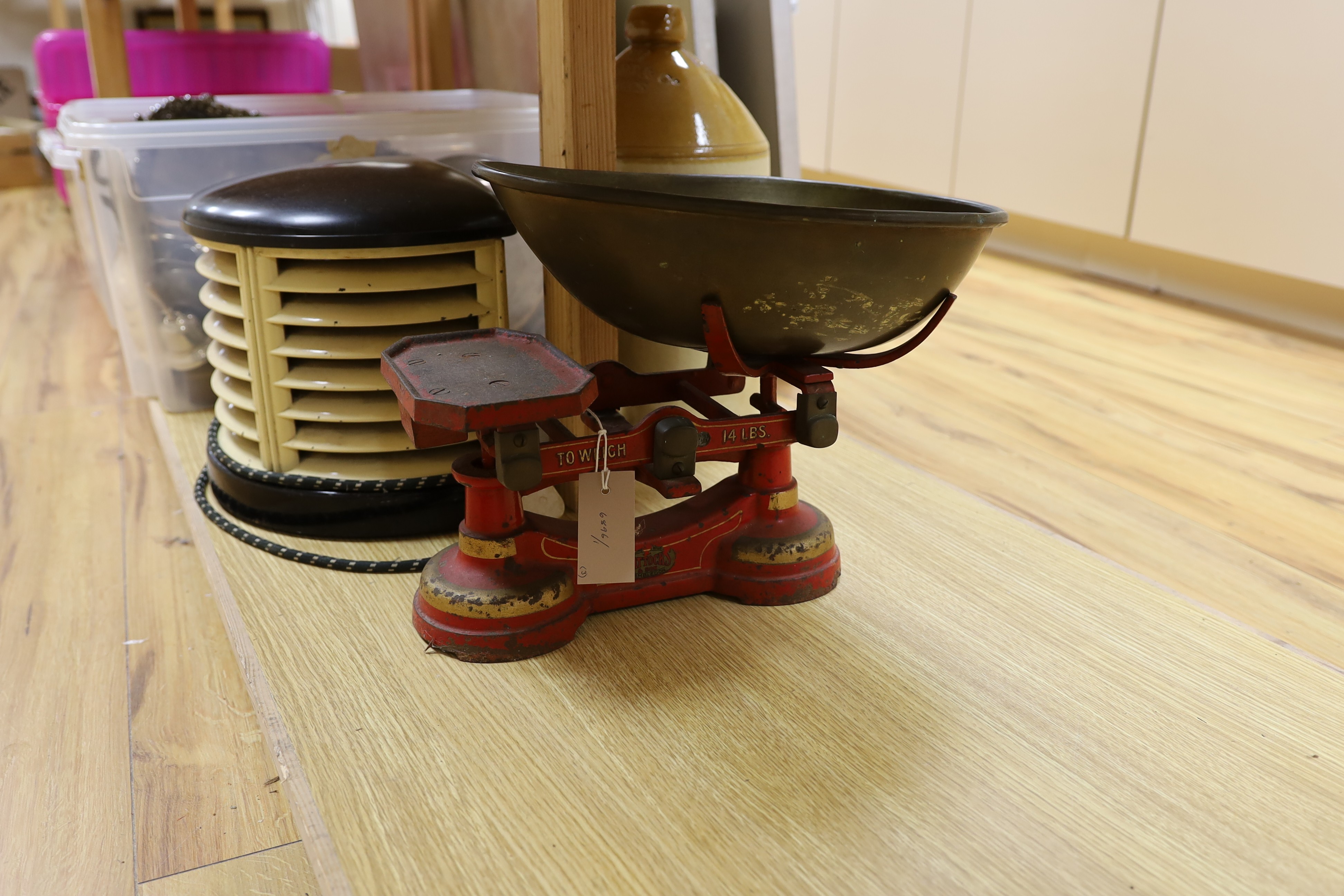 A 1930's HMV bakelite electric heater, A Mattocks cast iron weighing scale and a Lewes stoneware jar